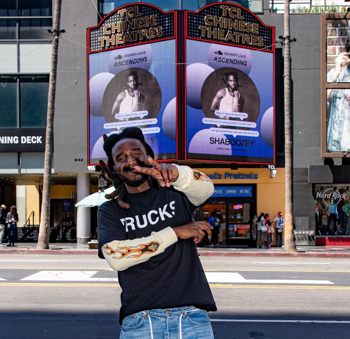 Shaboozy wearing Axel Co Panhead Thermal in front of his billboard