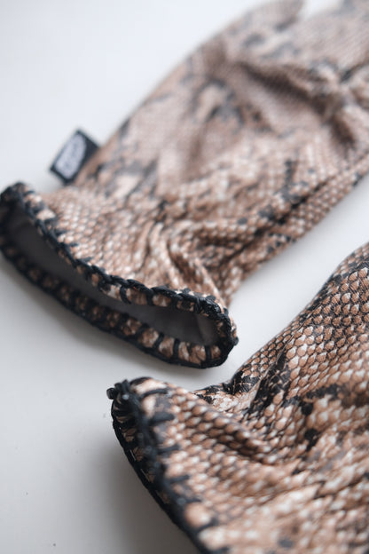 Pair of Motorcycle Gloves with snake skin pattern on a white background