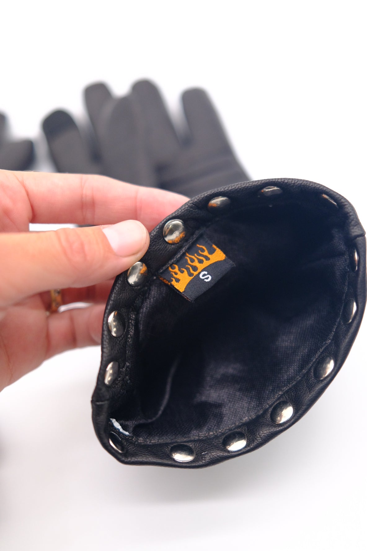 Black leather glove with studs with flame details